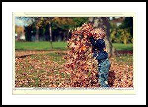 08.01.01.12.B — People — Child Playing in Leaves — SoloPhoto™